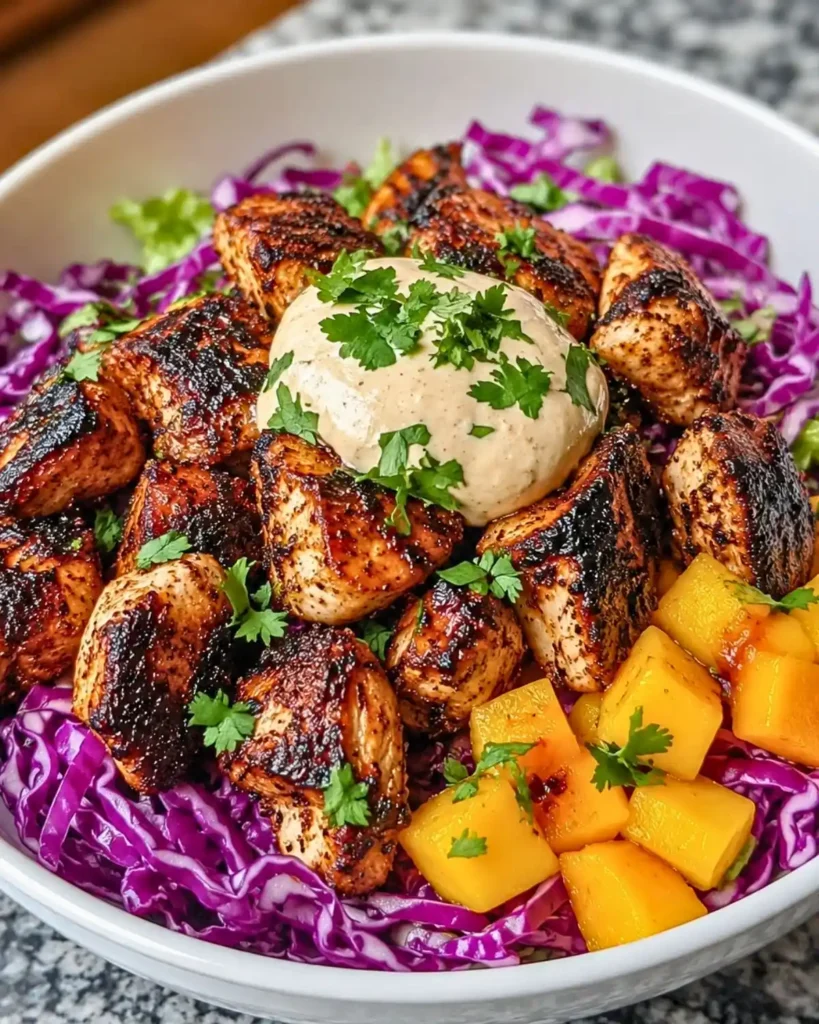 Jerk Chicken Bowls with Mango Slaw and Honey Lime Crema
