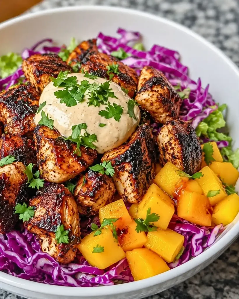 Jerk Chicken Bowls with Mango Slaw and Honey Lime Crema