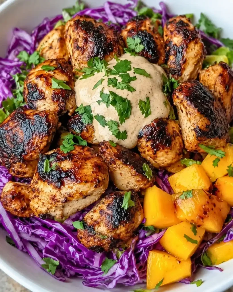 Jerk Chicken Bowls with Mango Slaw and Honey Lime Crema